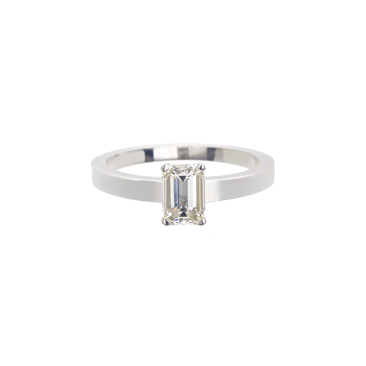 18K SOLITAIRE RING WITH EMERALD CUT DIAMOND