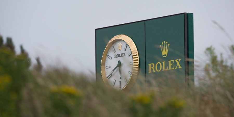 Billboard of Rolex with clock on it. 